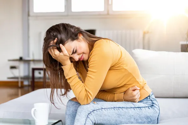 A woman experiencing pain relief after physiotherapy